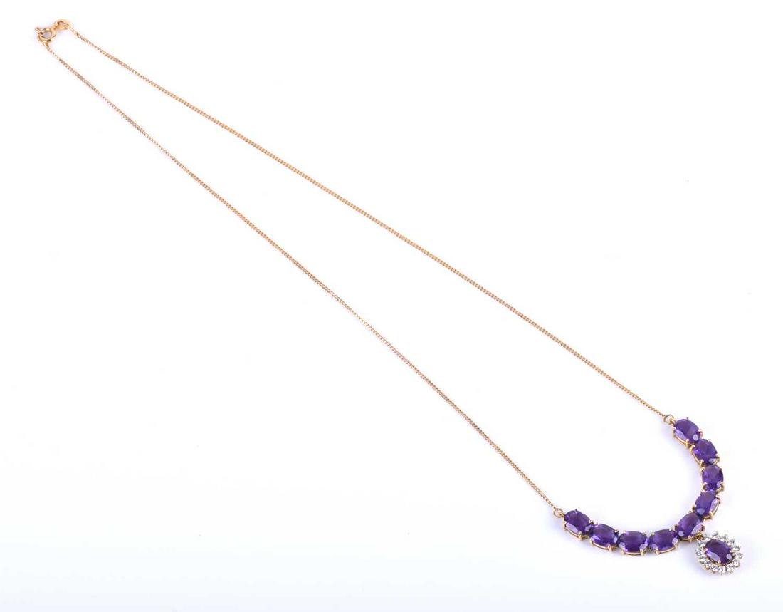 A 14ct yellow gold, amethyst and CZ necklace, set with: A 14ct yellow gold, amethyst and CZ necklace, set with an articulated line of mixed oval-cut amethysts, approximately 6 cm long, suspended with an amethyst and cz oval cluster, suspended on a yellow m