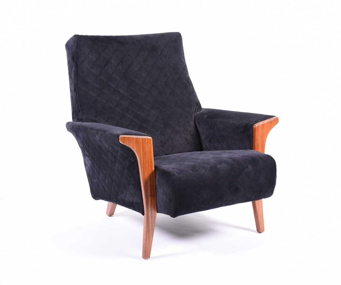An Ercol upoholstred and quilted armchair, with: An Ercol upoholstred and quilted armchair, with hardwood frame and upholstered in black quilted velvet fabric.
