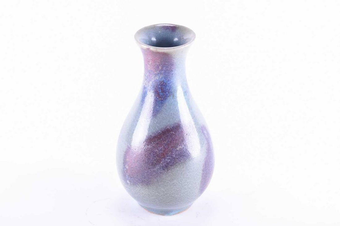 A Chinese jun style vase, the blue/green glaze with: A Chinese jun style vase, the blue/green glaze with splashes of aubergine, 21.5cmCondition report: No obvious faults visible