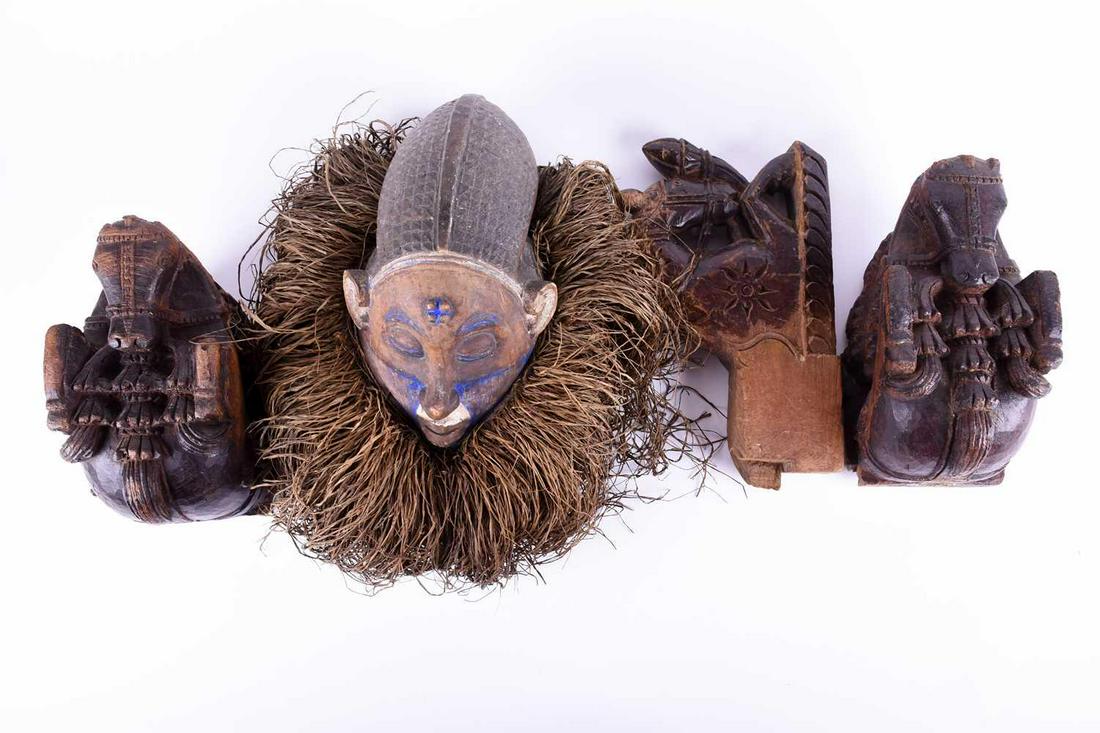 An African tribal head mask with painted face and grass (1 of 9)