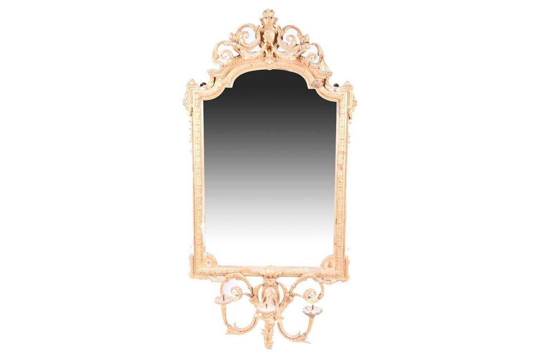 A 19th century carved and gilded gesso girondole wall: A 19th century carved and gilded gesso girondole wall mirror, with top with foliate scrolled crest, the mirror with acanthus border, and scrolled triple girondole below. 127 cm high, 63 cm wide.