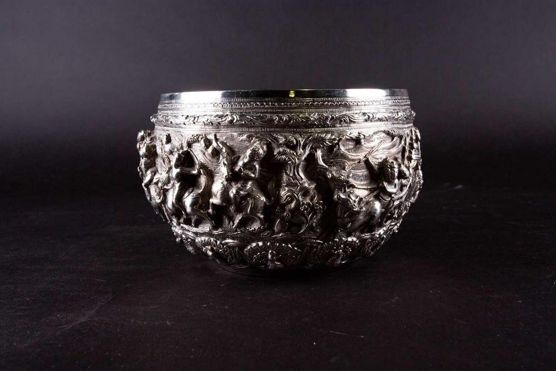 An Indian silver bowl, typically relief decorated with (1 of 4)