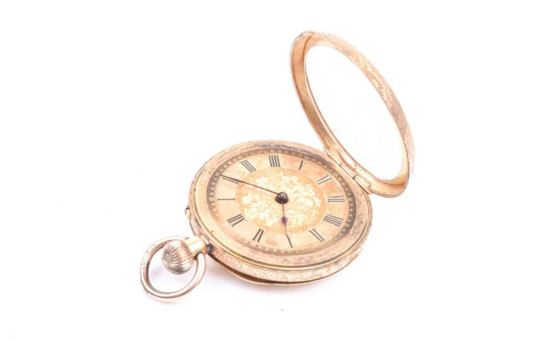 An 18ct yellow gold cased pocket watch, the gilt Roman: An 18ct yellow gold cased pocket watch, the gilt Roman numeral dial with engraved decoration, the cased with engraved and engine-turned decoration, case 3.5 cm diameter.