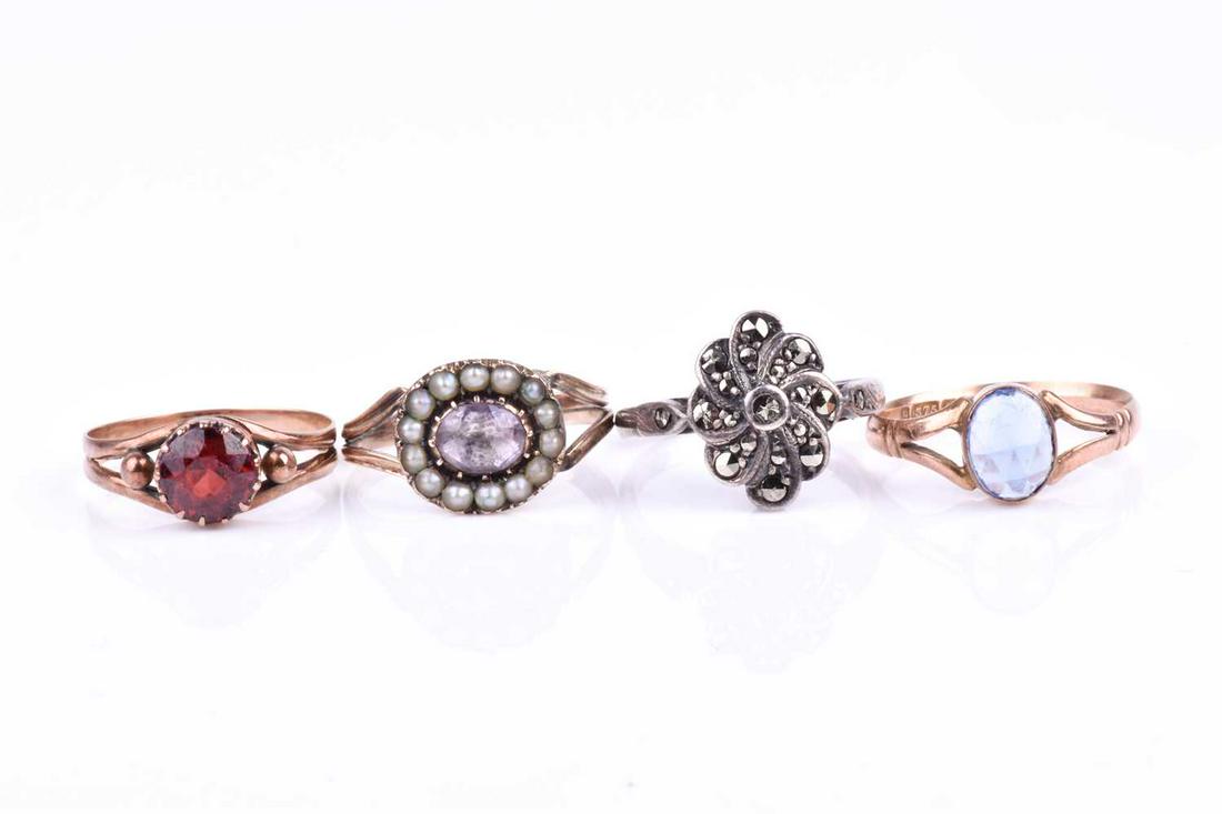 A 19th century yellow gold, amethyst, and split seed: A 19th century yellow gold, amethyst, and split seed pearl ring, set with a mixed oval-cut amethyst in a backed setting, within a border of pearls, split shoulders, the shank a/f (in need of repair), 