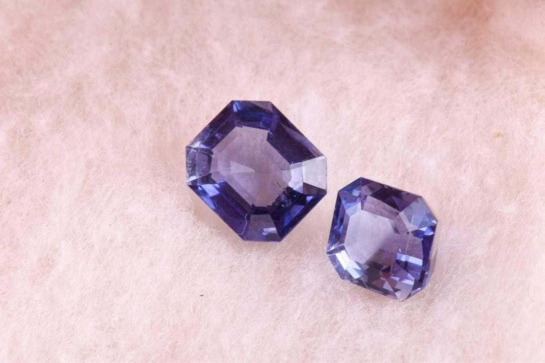 Two loose iolite gemstones of approximatey 5.0 carats: Two loose iolite gemstones of approximatey 5.0 carats combined, together with a yellow gemstone (possibly sapphire), a small blue benitoite, approximately 0.048 carats, and a loose opal of approximate