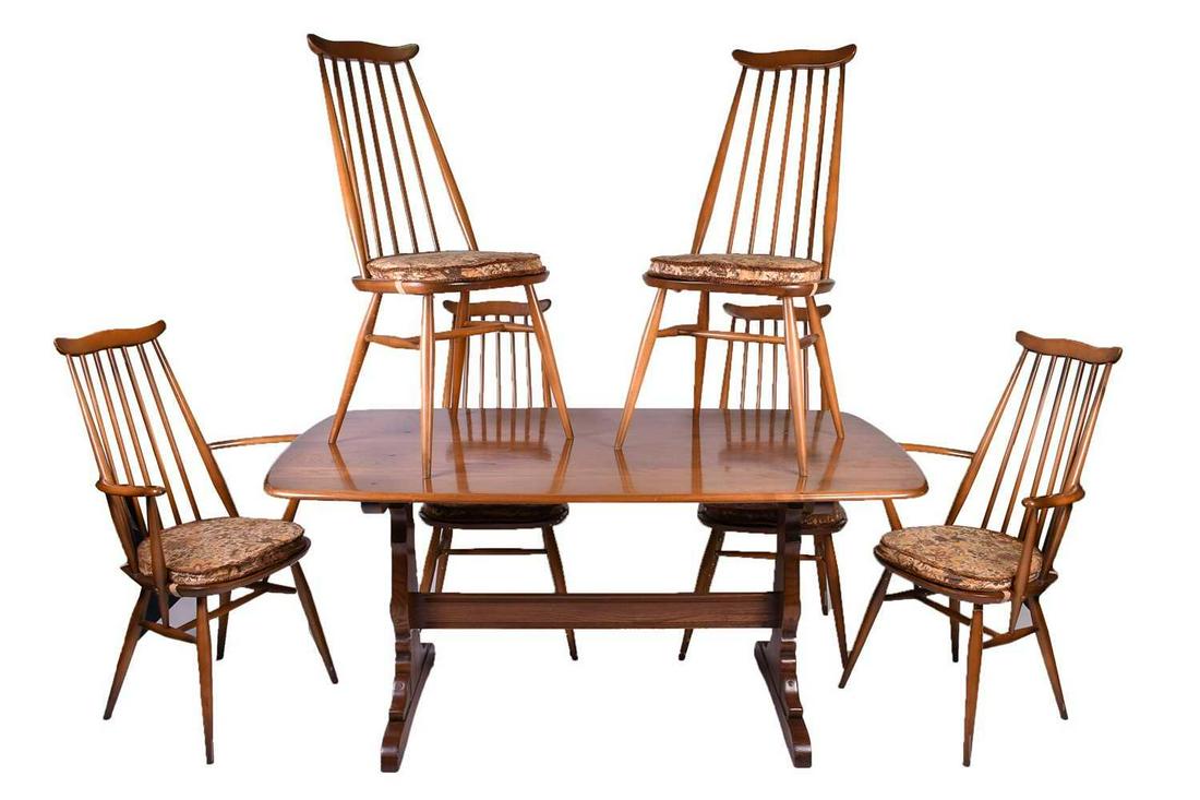 Lucian Ercolani for Ercol, a mid-20th century beech: Lucian Ercolani for Ercol, a mid-20th century beech dining room suite, comprising a refectory style dining table with column legs and splayed feet, together with a set of six Ercol model 369 Goldsmith