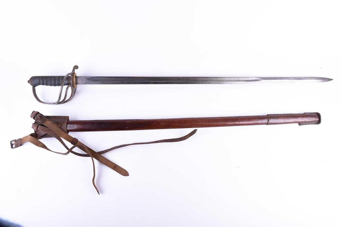 An early George V Royal Artillery dress sword, the part: An early George V Royal Artillery dress sword, the part fullered blade with etched decoration, by Henry Wilkinson, Pall Mall, London, with three bar hilt and shagreen grip, in leather scabbard, the bl