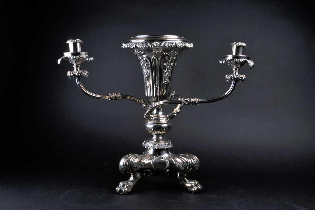 A silver plated centerpiece/epergne, the vase with: A silver plated centerpiece/epergne, the vase with leafy scroll and shell rim above the pierced body decorated with bellflowers, on as knopped stem with three candle branches, on lion paw and leaf cap