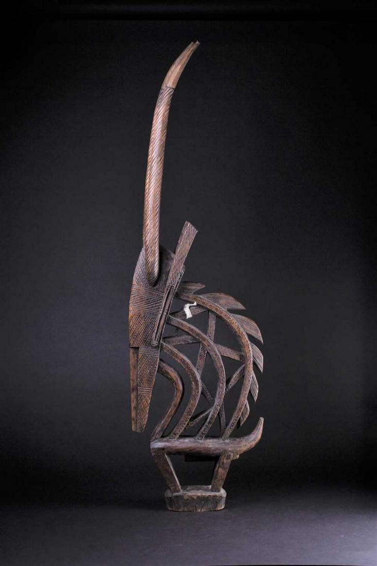 A Bamana antelope headdress, Mali, with chip carved: A Bamana antelope headdress, Mali, with chip carved decoration, 101cm