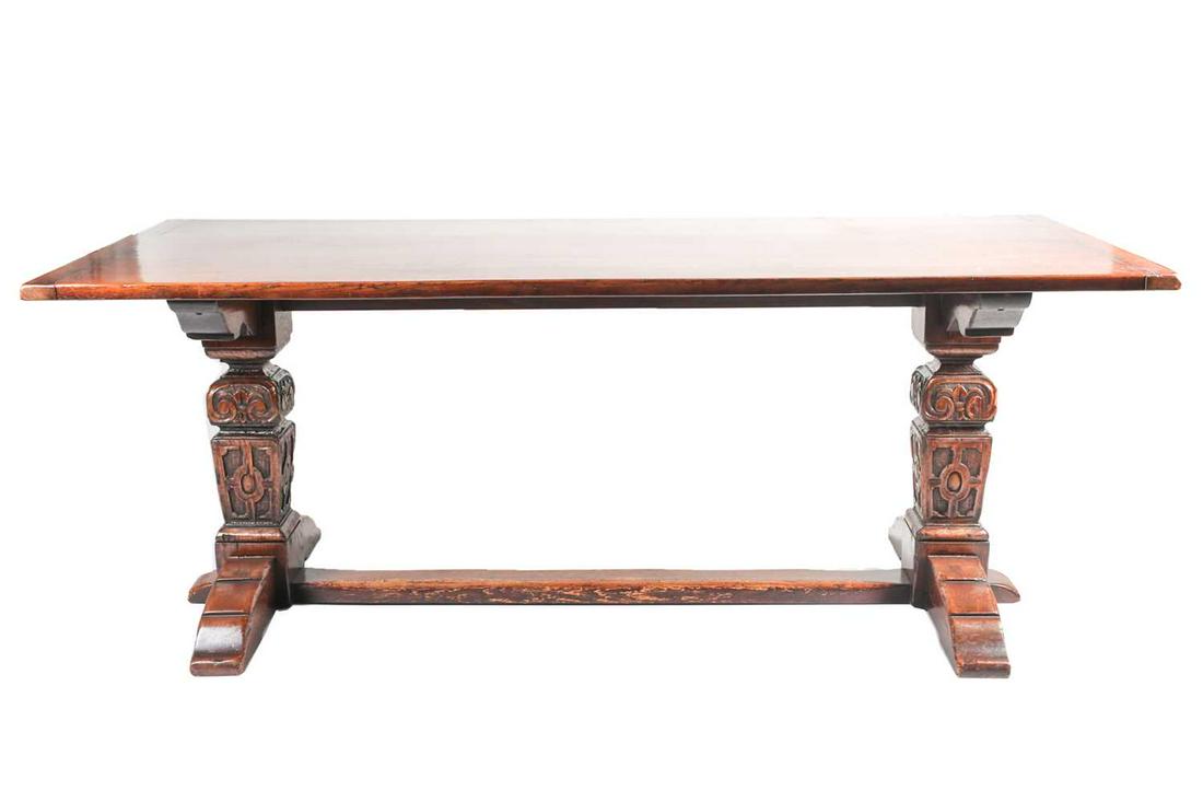 A 17th century style oak refectory table by G, T: A 17th century style oak refectory table by G, T Rackstraw of Worcester. With clamped plank top. Raised carved heavy square section supports joined by a central cross stretcher with substantial sledge