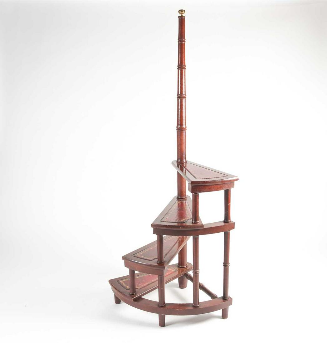 A set of reproduction mahogany and red leather: A set of reproduction mahogany and red leather half-spiral library steps, 161 cm high.