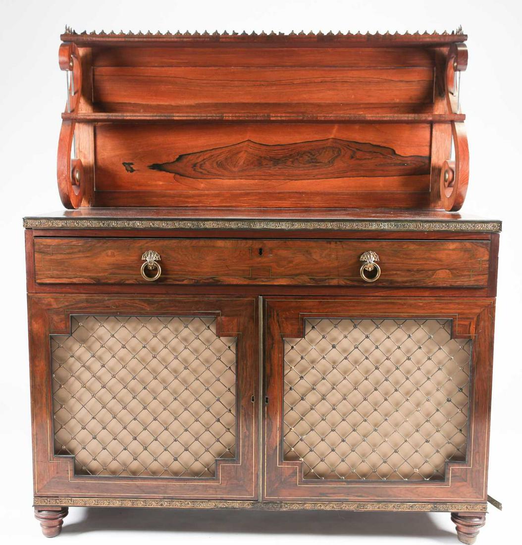 A Regency brass mounted and inlaid figured rosewood: A Regency brass mounted and inlaid figured rosewood chiffonier in the manner of John McLean, with single shelf galleried superstructure and Vitruvian scroll supports, above a single frieze drawer and