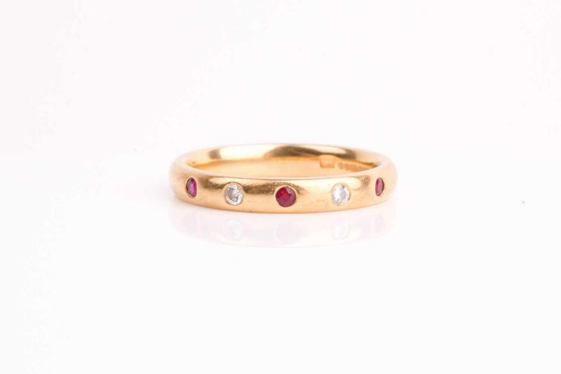 A diamond and ruby half eternity ring, the circular (1 of 4)