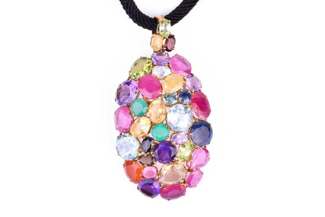 A yellow metal and multi-gem pendant of oval design, (1 of 3)