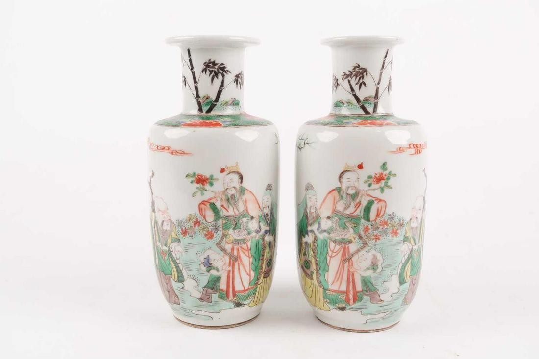 A pair of famille verte rouleau vases, late Qing/early: A pair of famille verte rouleau vases, late Qing/early Republic, the necks painted with bamboo shoots above a lotus and ammonite scroll shoulder, the body painted with the three star gods Lu, Fu & Sho