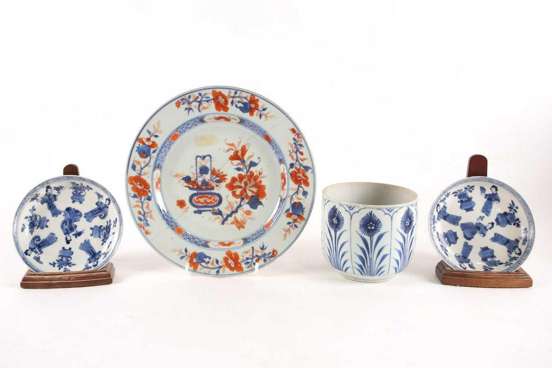A pair of Chinese blue & white saucers, Kangxi, each: A pair of Chinese blue & white saucers, Kangxi, each finely potted, painted with five females holding either a bird or floral sprig between flowering jardinieres, within a hatched border, a single cha