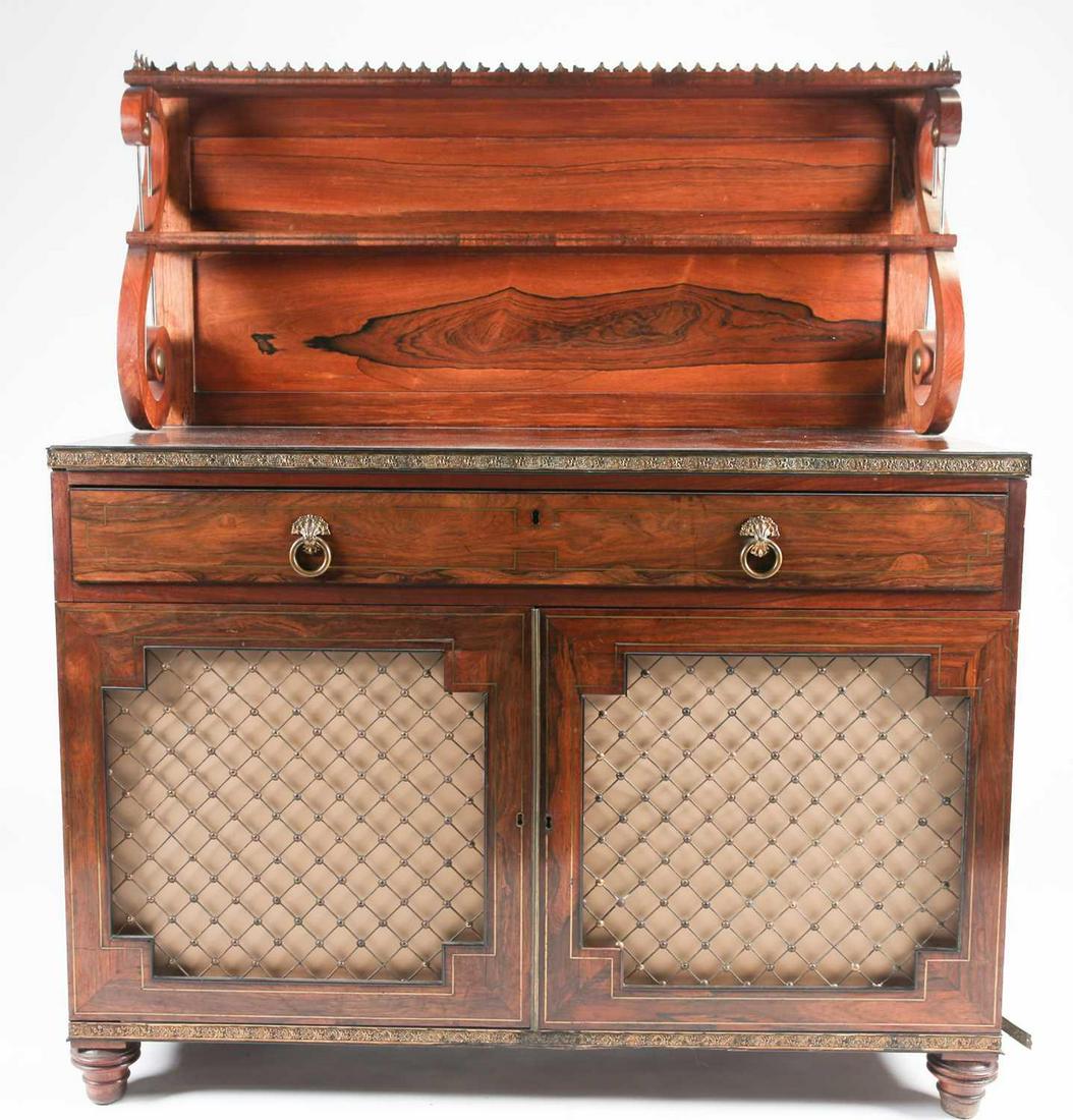 A Regency brass mounted and inlaid figured rosewood: A Regency brass mounted and inlaid figured rosewood chiffonier in the manner of John McLean, with single shelf galleried superstructure and Vitruvian scroll supports, above a single frieze drawer and