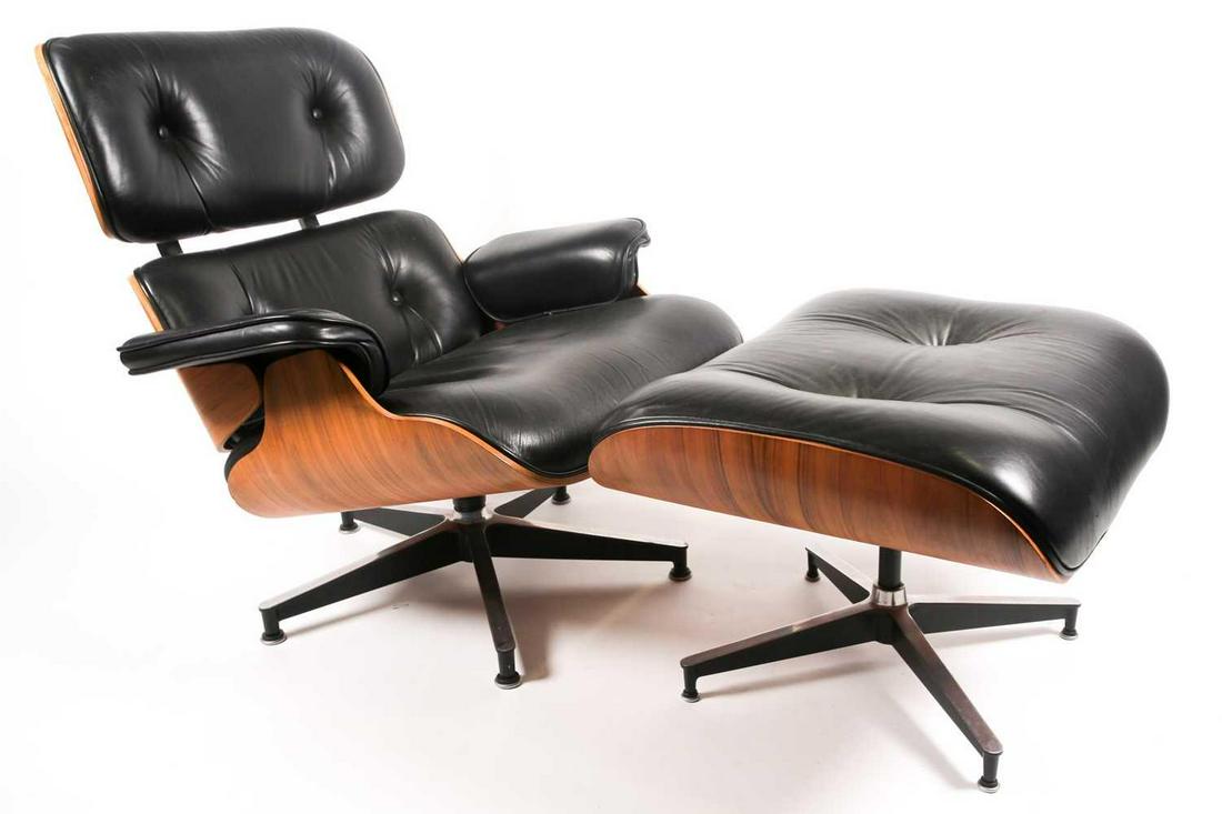 After Ray & Charles Eames, a reproduction 670 lounge: After Ray & Charles Eames, a reproduction 670 lounge chair and 671 ottoman, with laminated walnut outer shell and black buttoned leather upholstery. The chair ,83 cm wide x 46 cm high to the seat x 83