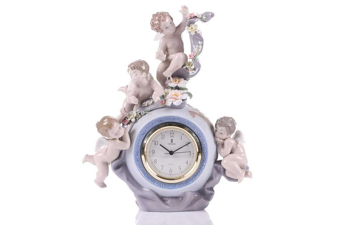 A Lladro porcelain "Angelic Time" (5973) figurative mantle clock. 25 cm wide x 28 cm overall height. (1 of 16)