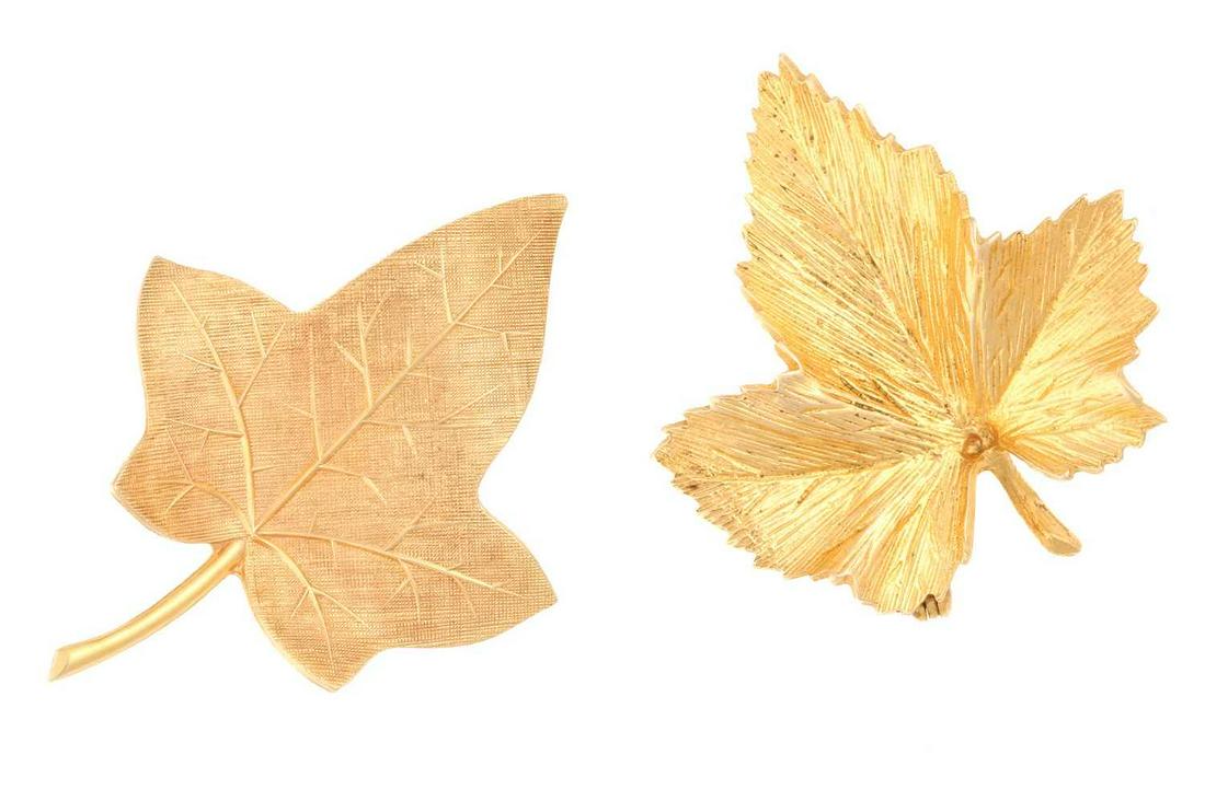 Two 9ct gold leaf brooches; including a textured maple leaf brooch fitted with a hinged pin and: Two 9ct gold leaf brooches; including a textured maple leaf brooch fitted with a hinged pin and roll-over clasp, London hallmarked '375' with maker's mark 'BJLd', 1969, 3.5 cm across; together with an