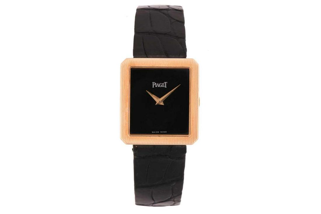 A Piaget protocol onyx dial watch, featuring an ultrathin hand-wound swiss made movement in a yellow: A Piaget protocol onyx dial watch, featuring an ultrathin hand-wound swiss made movement in a yellow metal case stamped 18kt and measuring 25mm, featuring an onyx set dial with dauphine gold hands, co