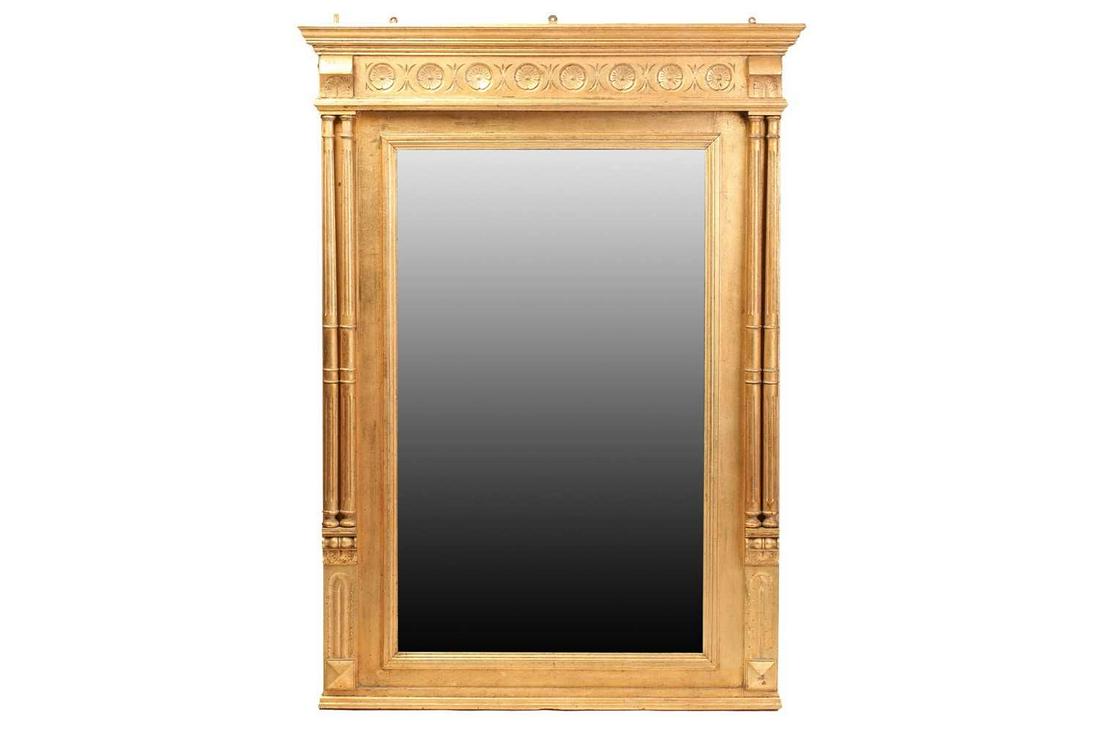 A Georgian style giltwood mirror, 20th century, the rectangular glass beneath a cavetto pediment and: A Georgian style giltwood mirror, 20th century, the rectangular glass beneath a cavetto pediment and flanked by twin columns, 135cm x 98cm