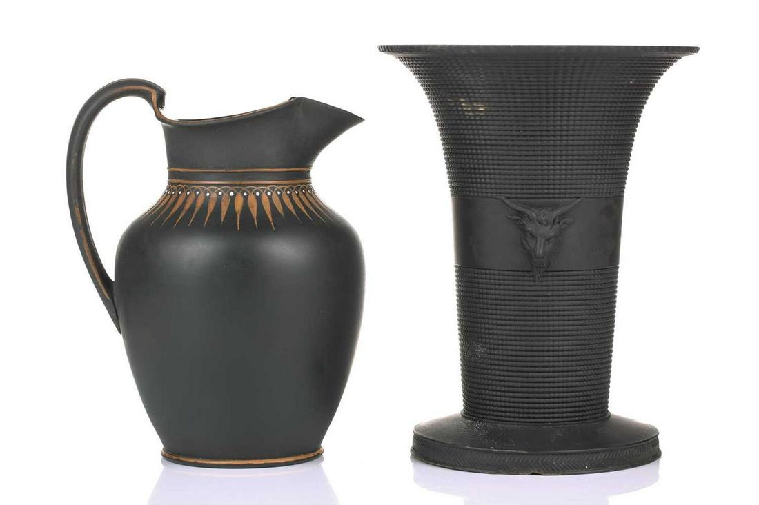 An early 19th century Wedgwood black basalt vase, of flared rim form with twin satyr mask: An early 19th century Wedgwood black basalt vase, of flared rim form with twin satyr mask decoration, on a spreading circular base, 18.5 cm, together with a similar period jug, of classical design wit