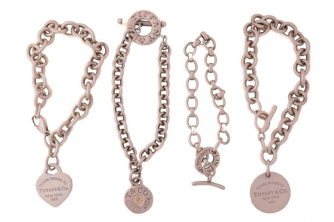 Three Tiffany & co. cable link bracelets with charm and another; including a Return to Tiffany: Three Tiffany & co. cable link bracelets with charm and another; including a Return to Tiffany toggle bracelet with round charm, London hallmarked 2008, 20.5 cm long; a Return to Tiffany bracelet with