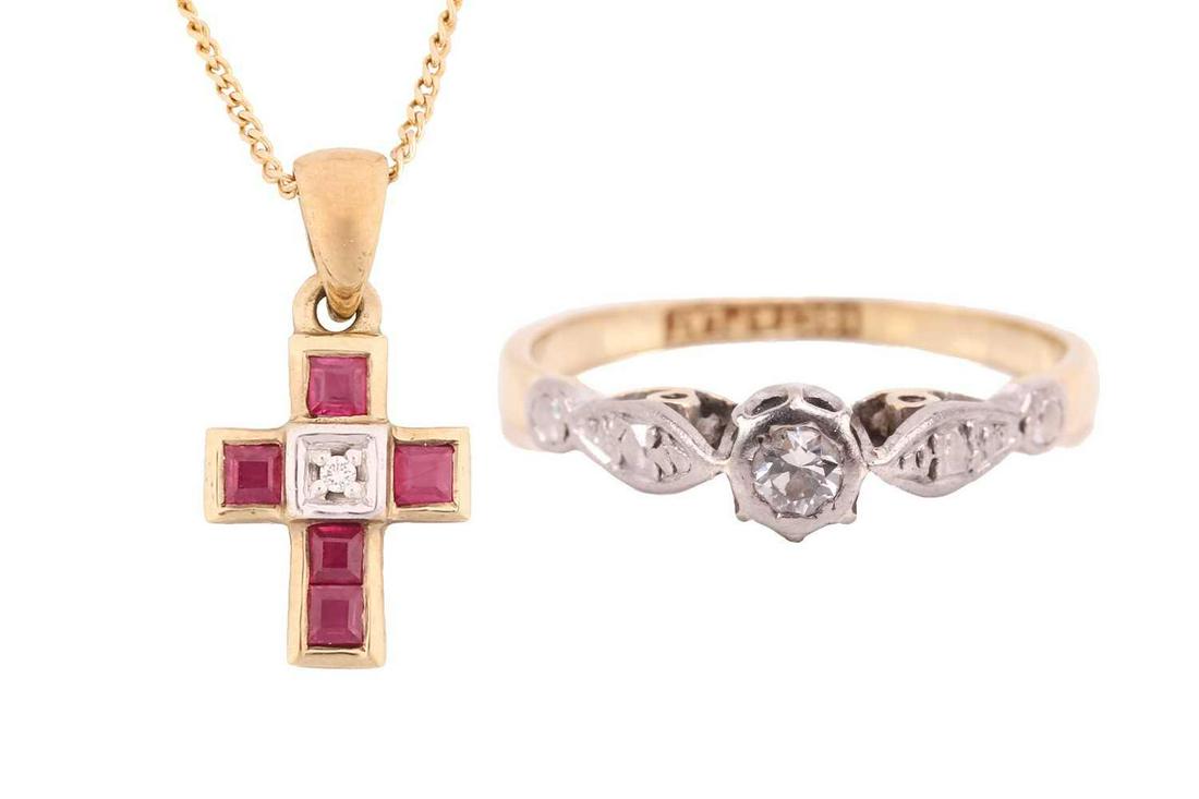 A diamond solitaire ring and a gem-set cross on chain; the ring contains a brilliant-cut diamond in: A diamond solitaire ring and a gem-set cross on chain; the ring contains a brilliant-cut diamond in a high-profile illusion mount, to shank marked '18ct&PLAT', size I; together with a synthetic ruby a