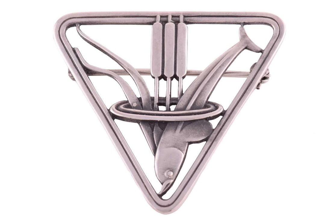 Georg Jensen - a triangular openwork brooch depicting a dolphin diving near some pond bulrushes, (1 of 2)