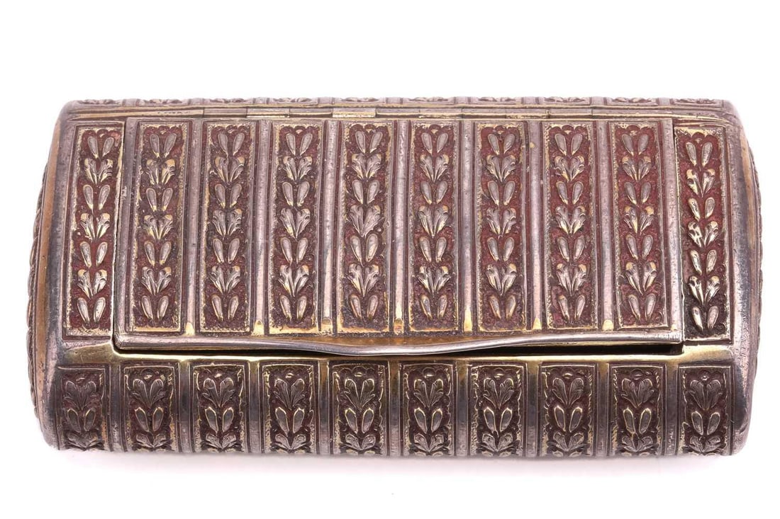 A George III heavy silver pill box of bolster form, London 1803 Makers mark indistinct, with: A George III heavy silver pill box of bolster form, London 1803 Makers mark indistinct, with flush-fitting hinged cover and chased with rows of acanthus. 3.1 ozt, 8 cm long x 4.5 cm deep.