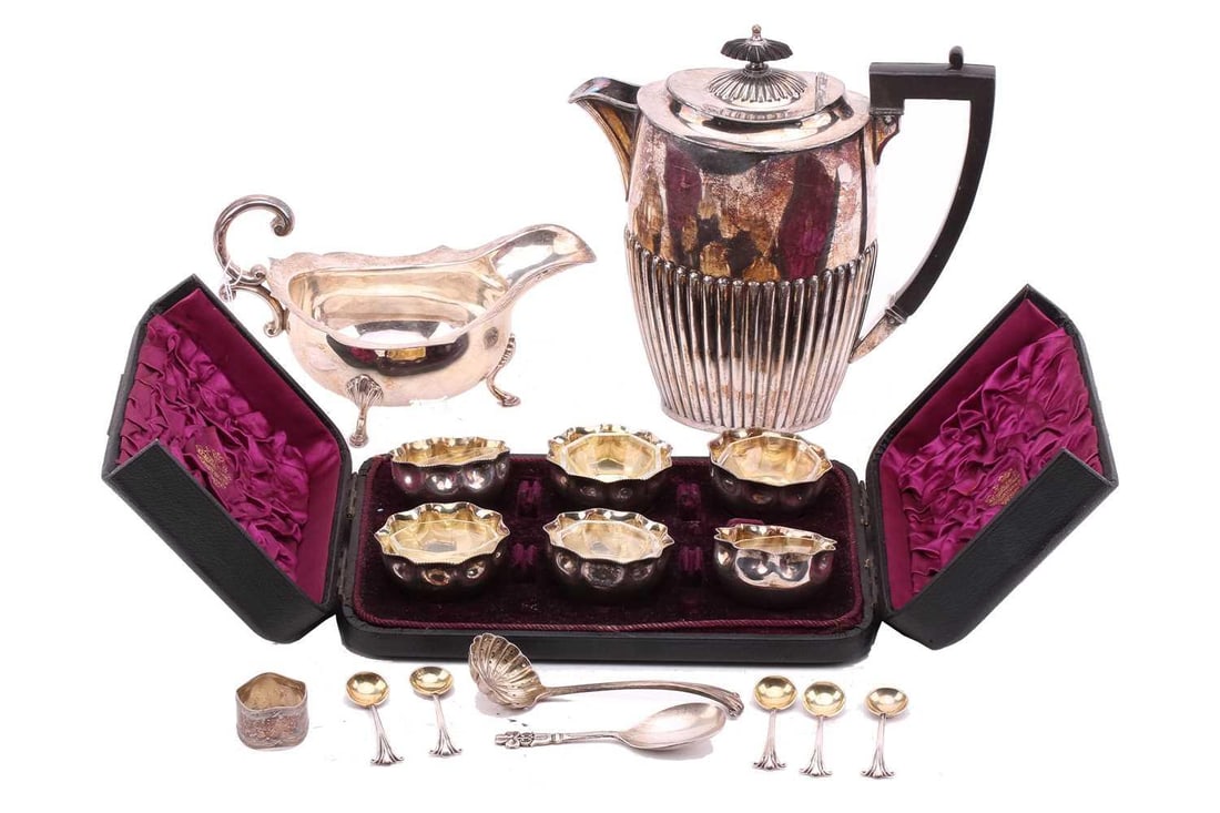 A cased set of six Victorian silver cauldron-type table salts, and spoons Birmingham 1888 by: A cased set of six Victorian silver cauldron-type table salts, and spoons Birmingham 1888 by Frederick Elkington, together with a silver gravy boat, napkin ring, sifting and caddy spoon and a silver p