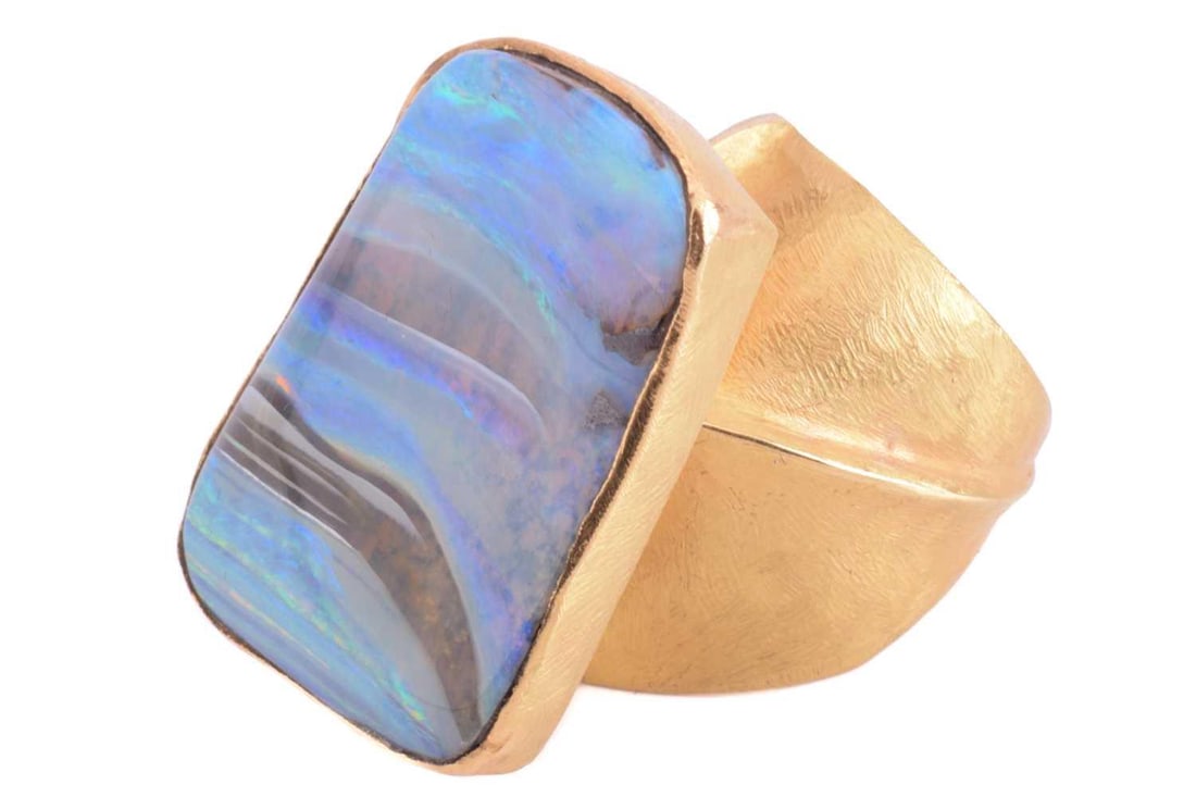 A yellow metal and boulder opal dress ring; the oblique shaped rectangular plaque within a textured (1 of 5)