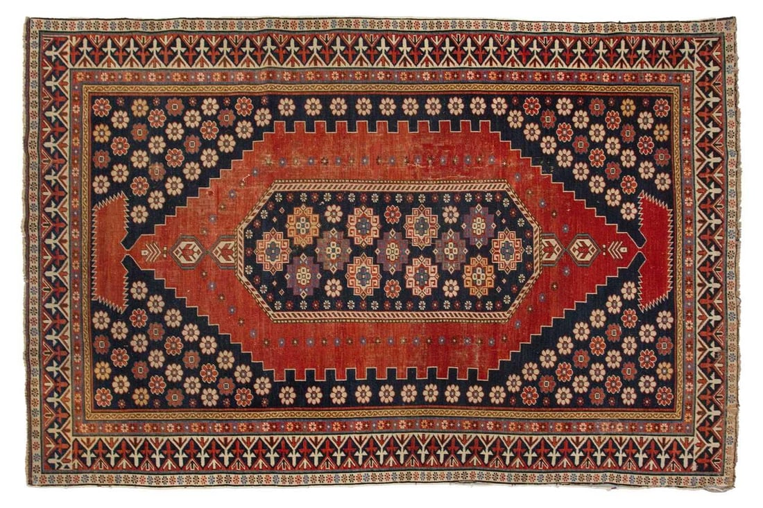 An antique Armenian Erivan rug with red ground and central lozenge the corners filled with flower (1 of 9)
