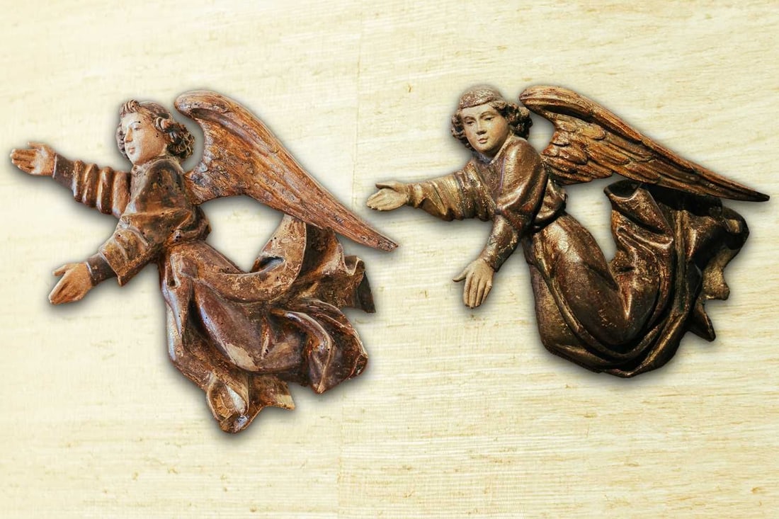 A pair of painted softwood flying cherubs, 18th/19th century, 37 cm wide x 36 cm high. Provenance:: A pair of painted softwood flying cherubs, 18th/19th century, 37 cm wide x 36 cm high. Provenance: The contents of The Birches, Kingston-upon-Thames