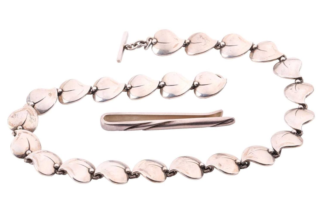 A George Jensen silver tie clip and a Niels Erik From necklace; the tie clip designed by Ole Kortzau: A George Jensen silver tie clip and a Niels Erik From necklace; the tie clip designed by Ole Kortzau for George Jensen, No. 162, signed with post-1945 maker's mark, struck with London import marks for