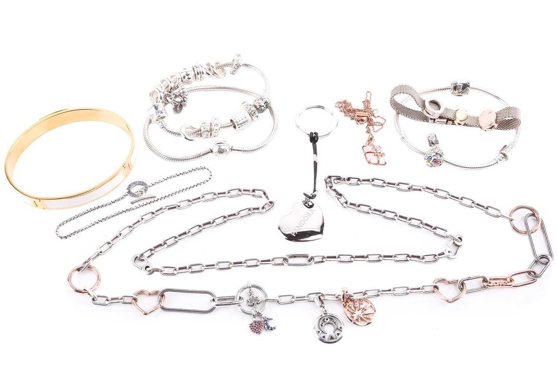 A collection of branded jewellery items from Pandora, Aspinal of London, Thomas Sabo and Links of: A collection of branded jewellery items from Pandora, Aspinal of London, Thomas Sabo and Links of London; includes three snake chain bracelets with charms by Pandora, a mesh bracelet with charms by Pa