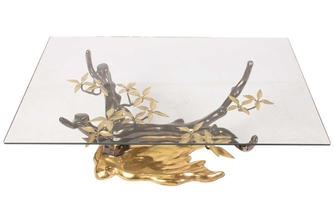 Willy Daro (20th century) French, a patinated brass and clear glass coffee table, the base formed as (1 of 4)