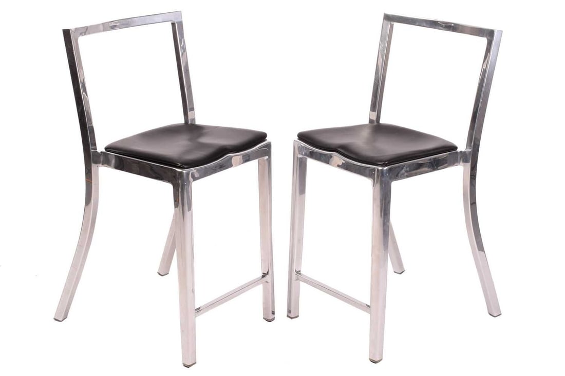 A pair of Icon chairs, by Philippe Starck for Emeco, aluminium frames, stamped to seat rail, 95 cm: A pair of Icon chairs, by Philippe Starck for Emeco, aluminium frames, stamped to seat rail, 95 cm high x 45 cm wide, the seats 63 cm high. Qty: (2)