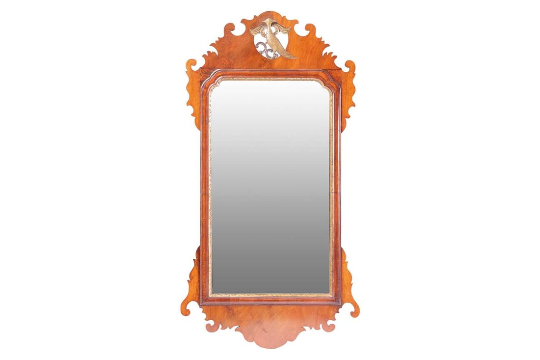 An 18th century style mahogany "HoHo" bird and scroll frame wall fretwork wall mirror, 20th century,: An 18th century style mahogany "HoHo" bird and scroll frame wall fretwork wall mirror, 20th century, 51 cm wide x 96 cm high A private estate