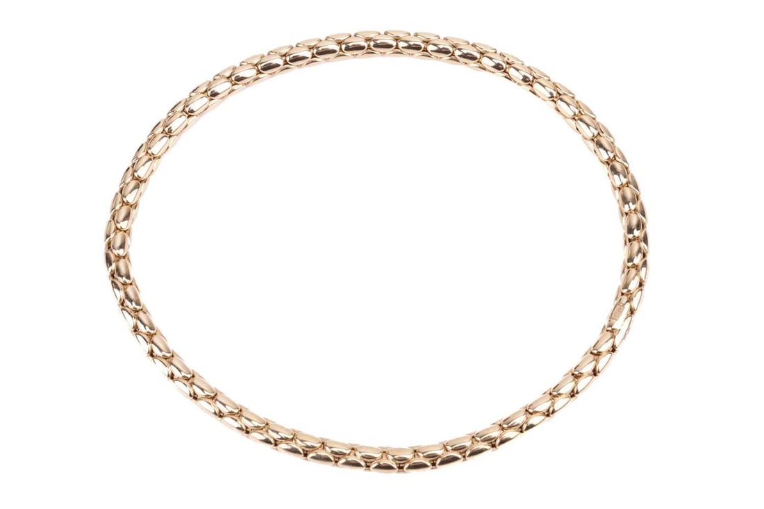 An 18ct yellow gold stretch bracelet by Chimento, with oval curved links, stamped '750' to the: An 18ct yellow gold stretch bracelet by Chimento, with oval curved links, stamped '750' to the reverse together with maker's marks and Italian hallmarks; featuring a titanium spring for adjustable siz