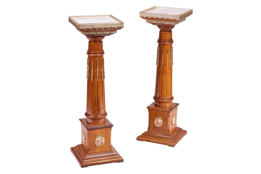 A pair of 20th century marble effect gallery-topped Louis XVI style pedestals, gilt metal mounts: A pair of 20th century marble effect gallery-topped Louis XVI style pedestals, gilt metal mounts throughout, with turned column stems, the stepped bases with decorative porcelain panels, 31 cm x 31 cm