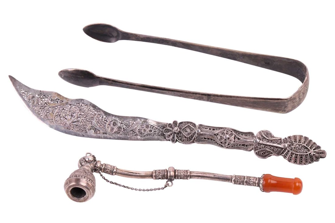 A Bezalel pipe, a Bezalel filigree knife and a pair of George III silver sugar tongs; the pipe appli (1 of 4)