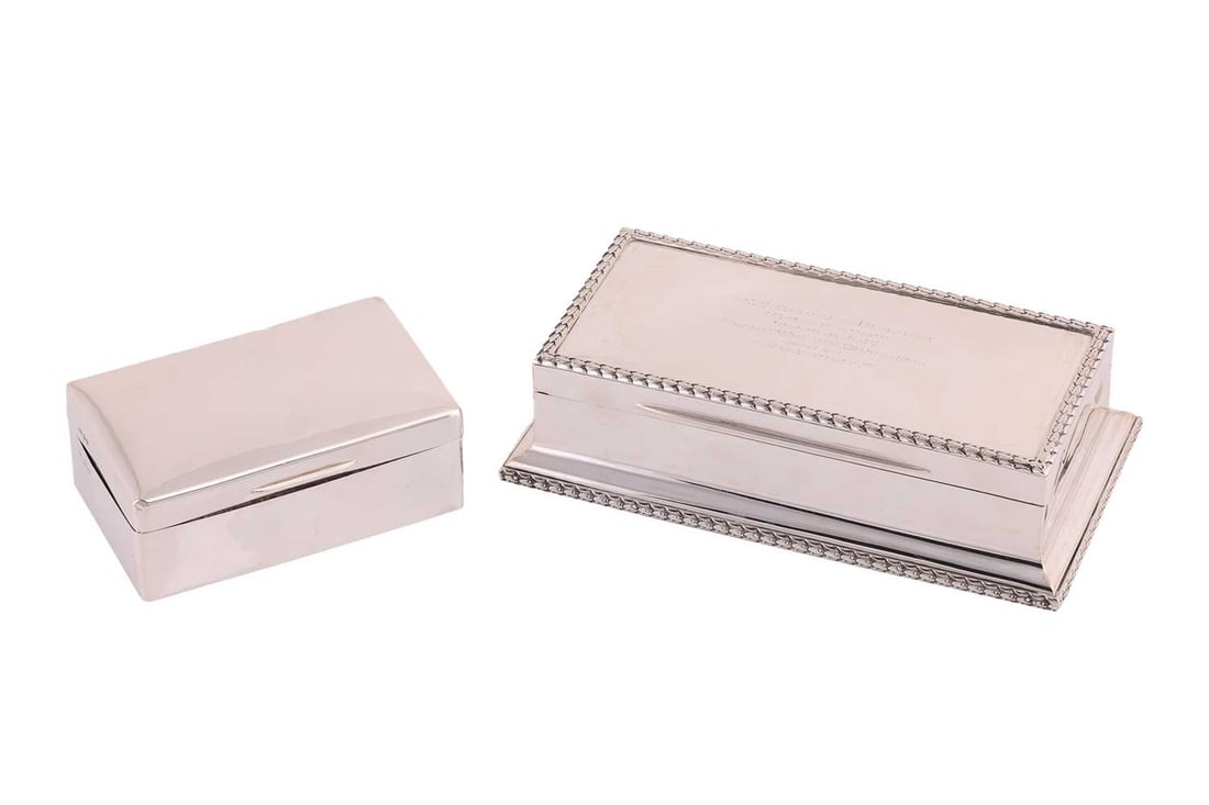 A silver bridge box of architectural pediment form, London 1912 makers mark rubbed, bordered by acan: A silver bridge box of architectural pediment form, London 1912 makers mark rubbed, bordered by acanthus chain borders, with presentation inscription the interior fitted and lined in tooled Morocco le