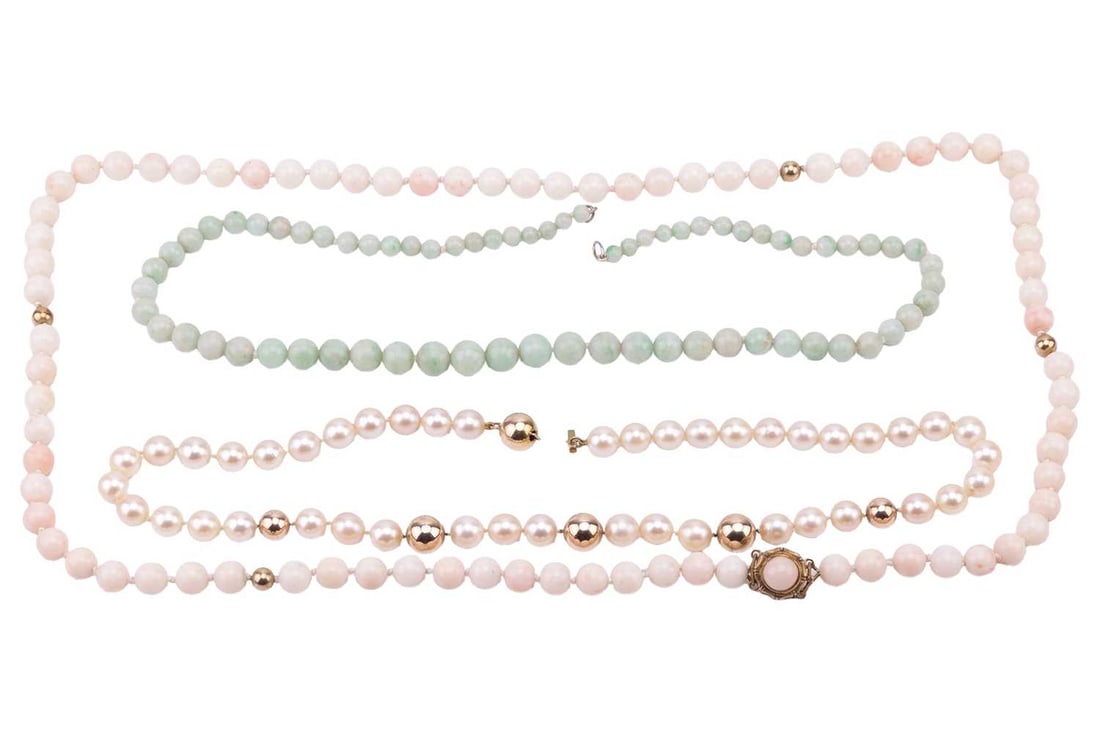 A single row coral bead necklace, 65cm long, the pale pink to cream coloured beads with four spheric (1 of 3)