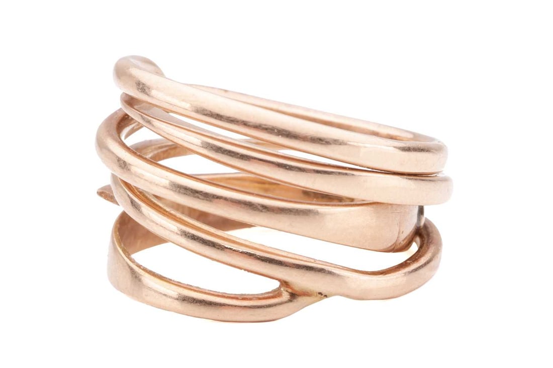 A Bent Knudsen 14ct yellow gold spiral ring, broken in one place leaving two separate parts, with ev: A Bent Knudsen 14ct yellow gold spiral ring, broken in one place leaving two separate parts, with evidence of repair, stamped with maker's mark 'Bent K', hallmarked 14ct gold with London import marks;