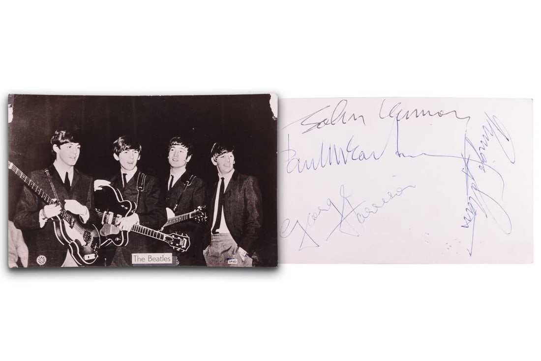 The Beatles: a black and white photographic postcard, signed verso by Paul McCartney, John Lennon,: The Beatles: a black and white photographic postcard, signed verso by Paul McCartney, John Lennon, Ringo Starr and George Harrison, each in different ink. From the autograph collection of Peter Burrow