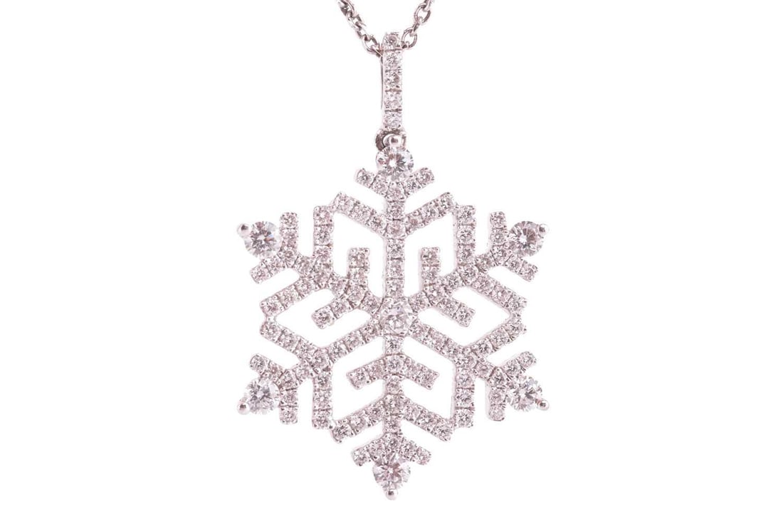 A diamond snowflake pendant on chain, set throughout with round brilliant cut diamonds, with a total: A diamond snowflake pendant on chain, set throughout with round brilliant cut diamonds, with a total estimated diamond weight of 1.13ct, in a snowflake design with diamond set bail, the reverse of the