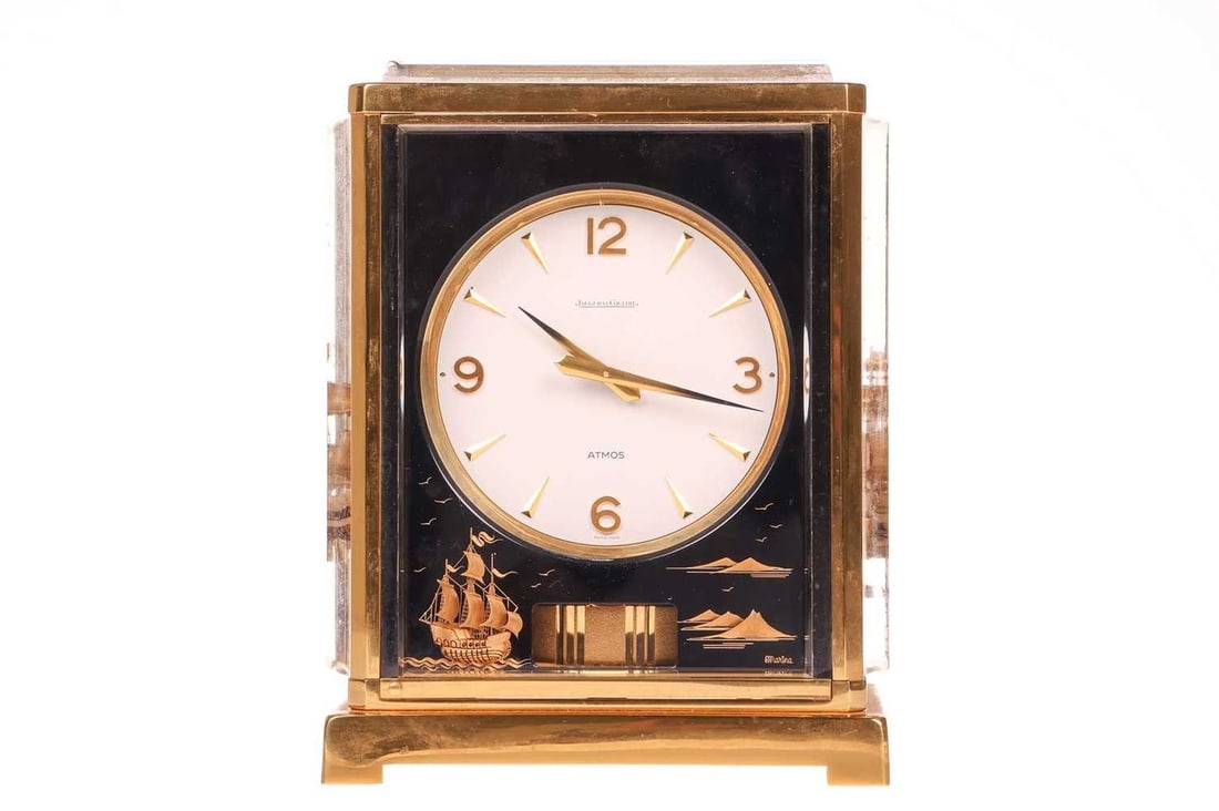 A Jaeger LeCoultre 'Marina' Atmos clock, the blacked perspex panels depicting sailing ships, the (1 of 5)