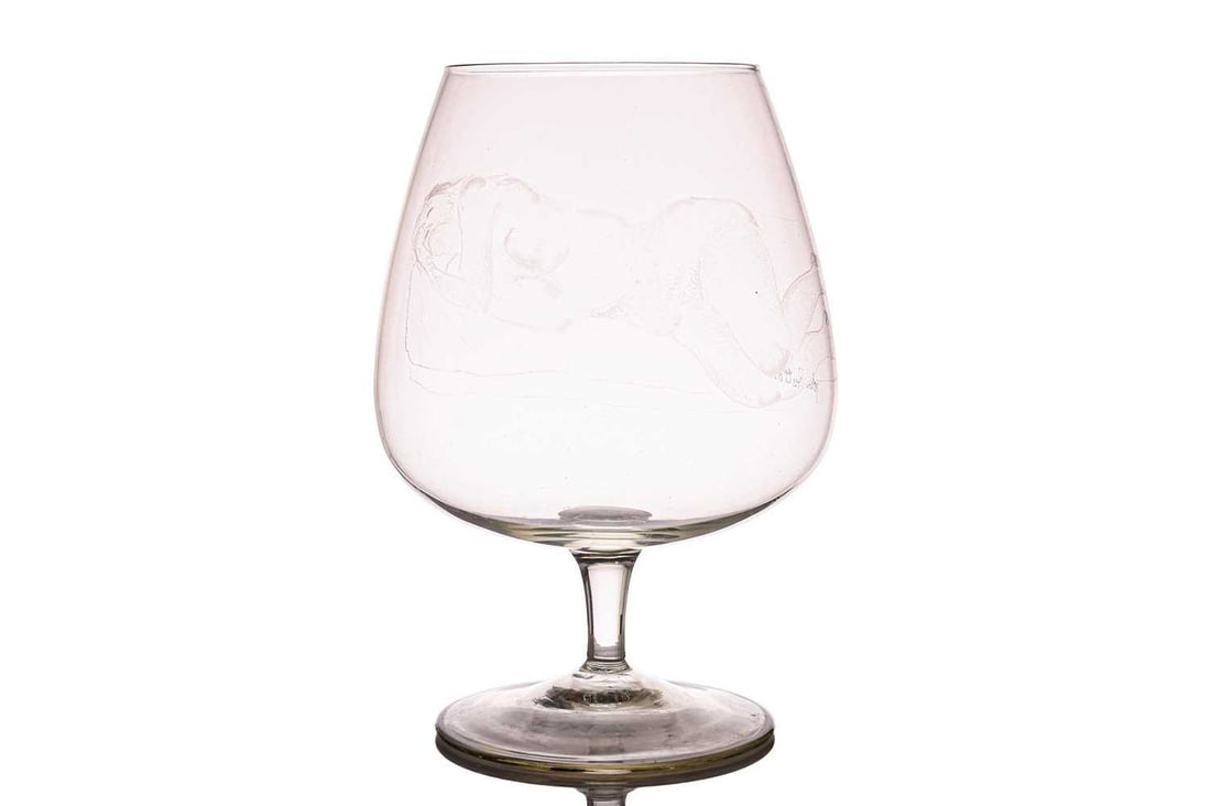 John Hutton (1906-1978), a large glass goblet with an etched design of a recumbent female nude,: John Hutton (1906-1978), a large glass goblet with an etched design of a recumbent female nude, signed, 24 cm high x 15 cm wide.